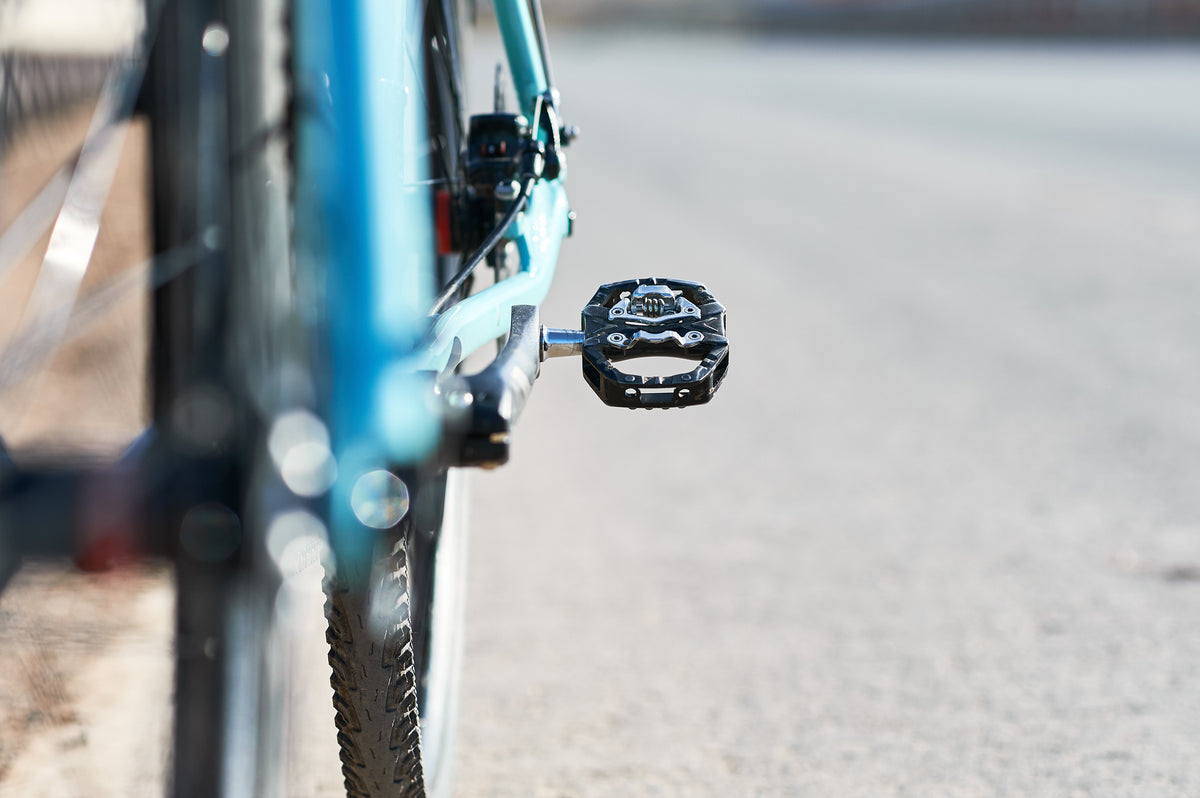Road bike quick release pedals close up on the street