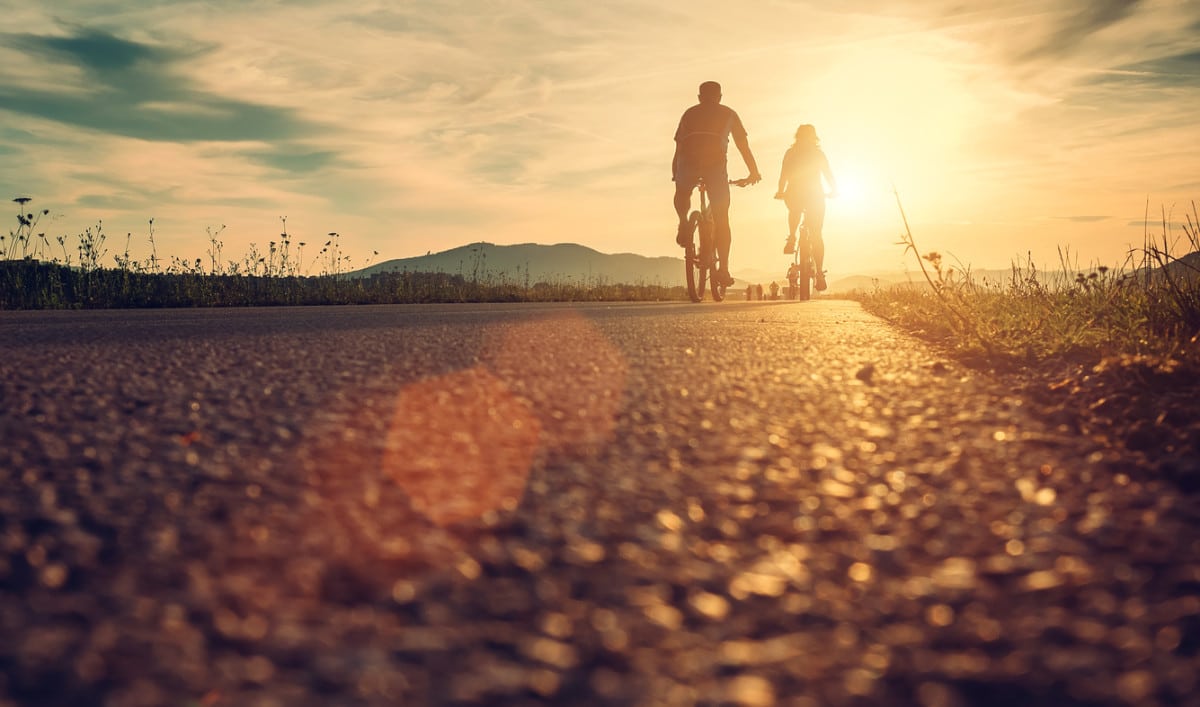 riding bikes while the sun is setting