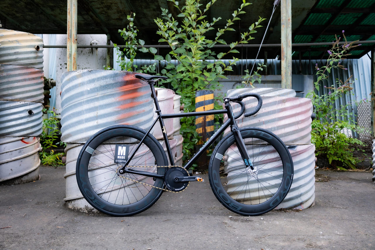 motion shot of male riding bike
