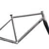 A silver Thomson bicycle frame with black fork, displayed on a white background.