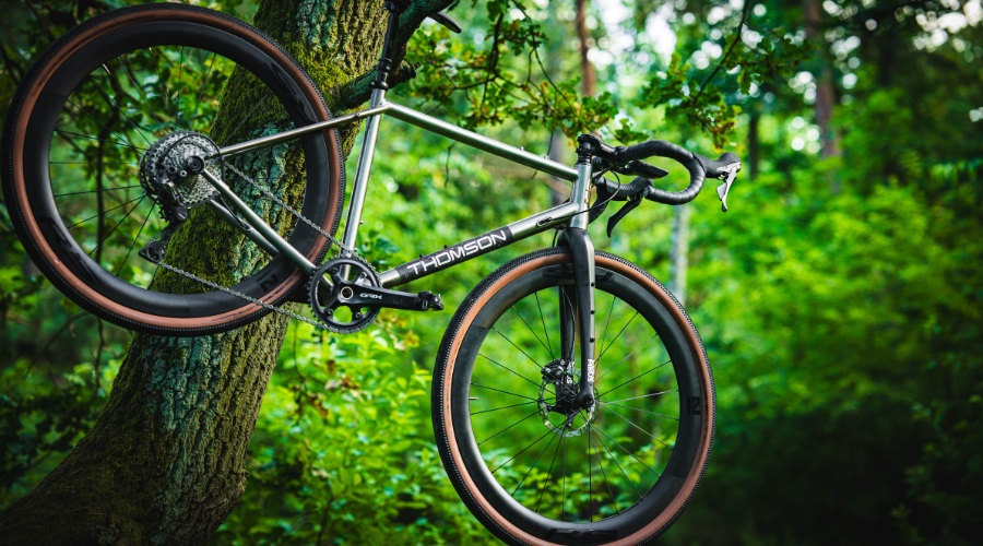 tiitanium bike hanging from a tree