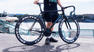 male holding skeeter bike frame