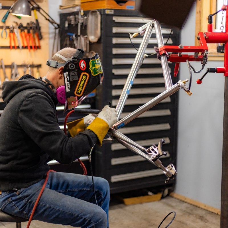 man building a gravel bike